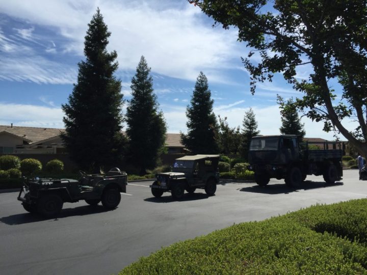 Antique military vehicles lined up for the Fourth of July parade.
