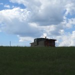 Old boxcar against a western sky.