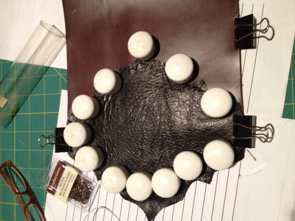 Clamp and weight the glued leather overnight.