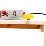 Jigsaw And Measuring Tape On Table